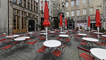 Empty tables in a deserted square in Cologne, Germany. March 18, 2021.