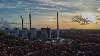 The sun sets behind the cole-fired power plant 'Scholven' of the Uniper energy company in Gelsenkirchen, Germany, on Oct. 22, 2022.