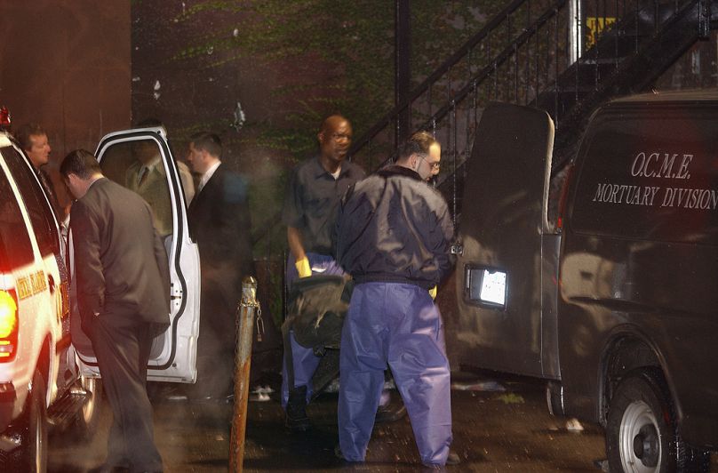 The body of Jason Mizell, a.k.a. Jam Master Jay, is removed from a recording studio where he was shot and killed on 30 October 2002.