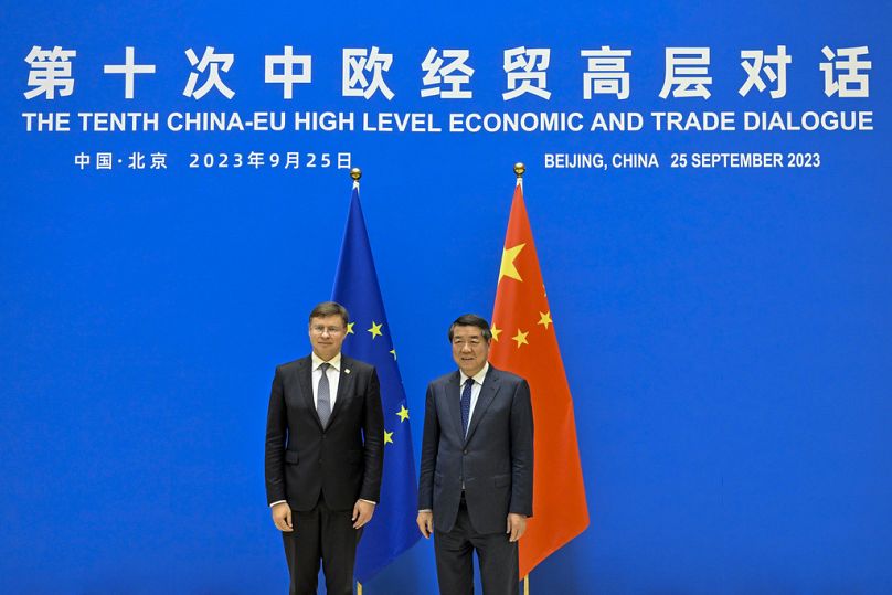 Chinese Vice Premier He Lifeng stands with Executive Vice President of European Commission Valdis Dombrovskis before the 10th China-EU High-level Economic and Trade Dialogue i