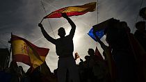 Demonstrators waves Spanish flags at Plaza del castillo square during a protest called by Spain's Conservative Popular Party.