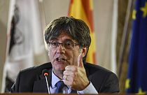Catalan leader Carles Puigdemont speaks at a press conference in Alghero, Sardinia, on Oct. 4, 2021