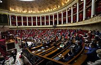 Parliament members attend a session of questions to the Government at the French National Assembly in Paris, France, Tuesday, Jan. 4, 2022.