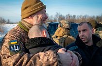Ukrainian prisoners of war react after a prisoner exchange at an undisclosed location, Ukraine. 