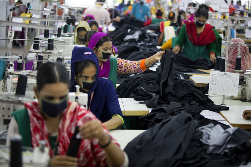 Bangladeshis work at Snowtex garment factory in Dhamrai, near Dhaka, April 2018