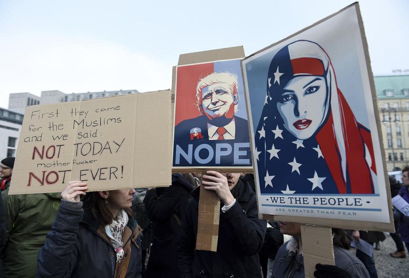 Protesters gather near the US embassy to demonstrate against the travel ban of US president Donald Trump in Berlin, February 2017