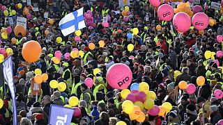 People take part in the Stop Now! demonstration against Finland's government's labour market policies in Helsinki's Senate Square in Finland on Thursday, Feb. 1, 2024. 