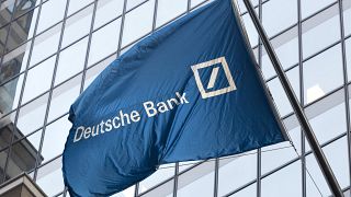 A flag for Deutsche Bank flies outside the German bank's New York offices on Wall Street. Oct. 7, 2016.