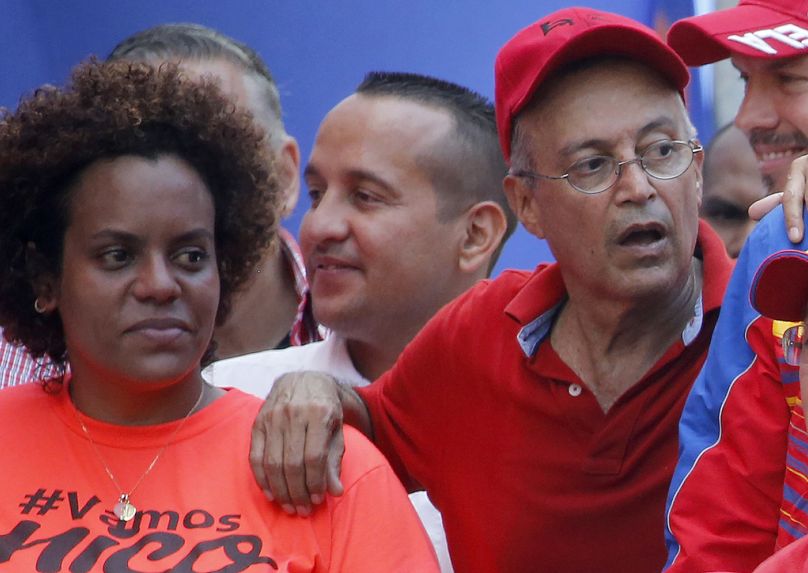 FILE - Luis Alfredo Motta Dominguez, right, who was spied on by the United States, attends a pro-government rally in Caracas, Venezuela, April 6, 2019.