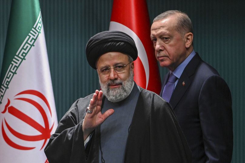 Iranian President Ebrahim Raisi, left, and Turkish President Recep Tayyip Erdogan leave after a joint news conference following their meeting.