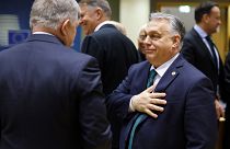 Hungary's Prime Minister Viktor Orban, right, talks to Slovakia's Prime Minister Robert Fico at an EU summit in Brussels, Thursday, Feb. 1, 2024. 