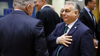 Hungary's Prime Minister Viktor Orban, right, talks to Slovakia's Prime Minister Robert Fico at an EU summit in Brussels, Thursday, Feb. 1, 2024. 