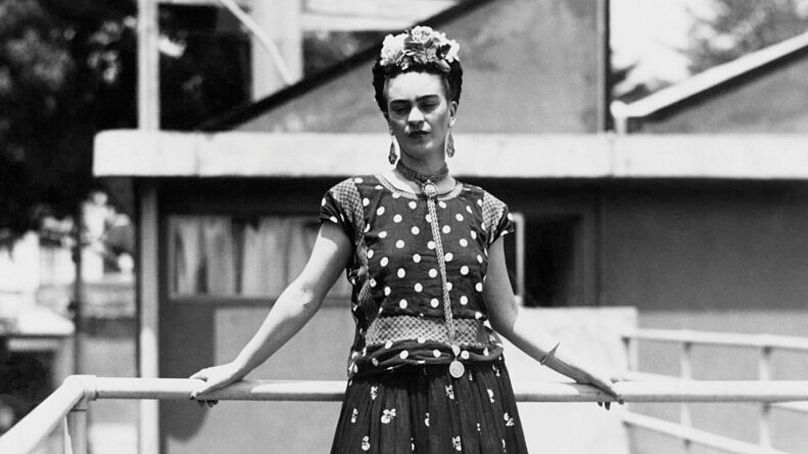 Frida Kahlo, painter and surrealist, wife of noted Mexican muralist Diego Rivera, poses at her home in Mexico City, 14 April 1939.