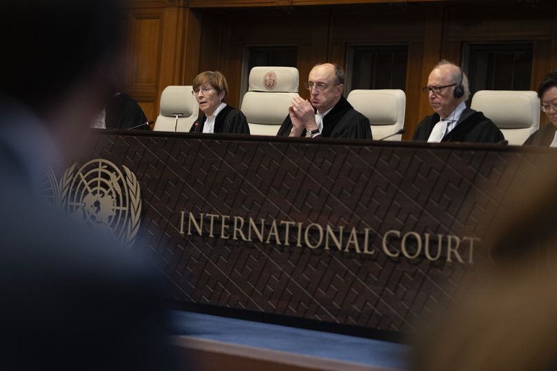 Presiding judge Joan Donoghue, left, reads the International Court of Justice's decision in the Ukrainian genocide case.