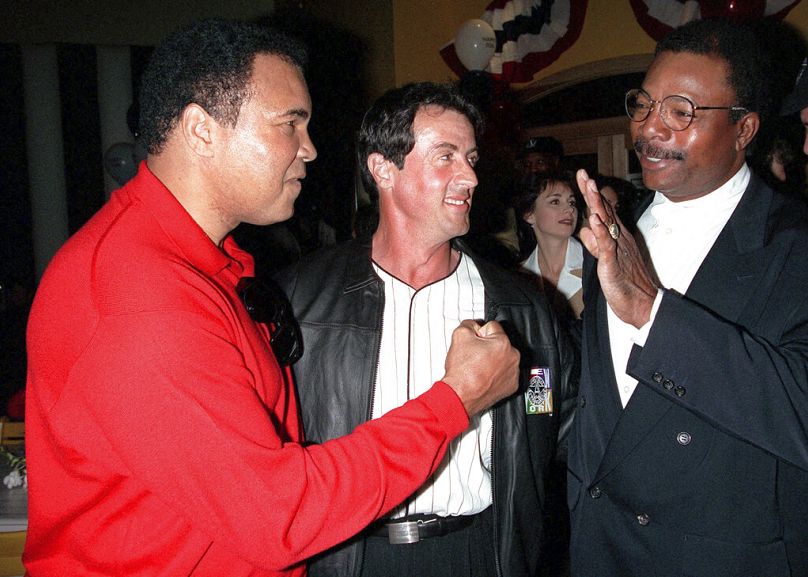 Former heavyweight boxing champion Muhammad Ali, left, joins Sylvester Stallone and Carl Weathers at 20th anniversary event for 'Rocky'