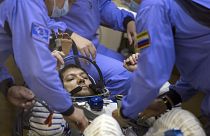  Russian Space Agency experts test a space suit of Russian cosmonaut Oleg Kononenko, before a launch on the Soyuz rocket.
