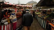 People shop at an open air market in Fontainebleau, south of Paris, France.
