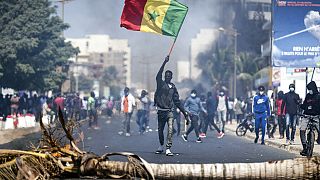 Senegal police fire tear gas at protest against election postponement