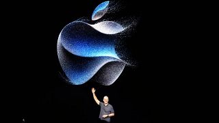 Apple CEO Tim Cook waves at an announcement of new products on Sept. 12, 2023, in Cupertino, Calif. 