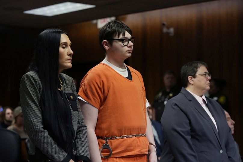 Ethan Crumbley stands with his attorneys Paulette Loftin, left, and Amy Hopp, Friday, Dec. 8, 2023, in Pontiac, Mich.