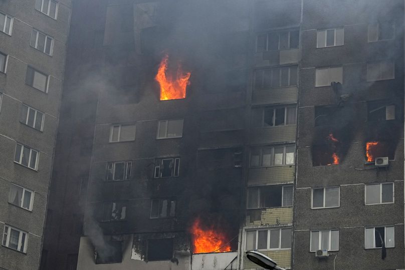 Fire and smoke rise out of an apartment building after Russian attack in Kyiv, Ukraine, Wednesday, Feb. 7, 2024.