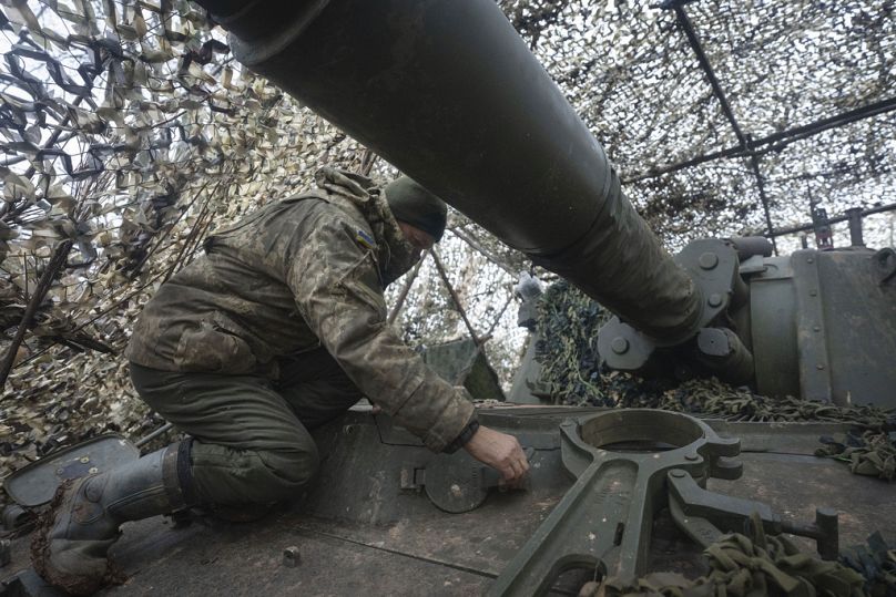 A soldier of the 12th Special Forces Brigade Azov of the National Guard prepares to fire a 155mm self-propelled gun M109 Paladin, towards Russian positions, 28 January, 2024.