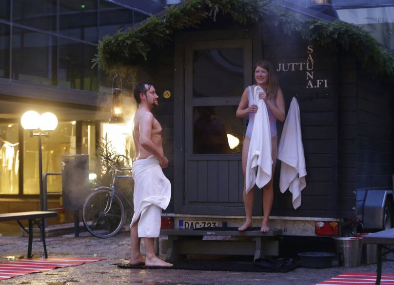Dare to bare? People emerge into the cold open air from a sauna in the historical centre of Helsinki, Finland