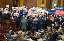 Opposition lawmakers hold banners reading: "Stole the elections" during a Serbia's parliament constitutive session in Belgrade, Serbia, Tuesday, Feb. 6, 2024