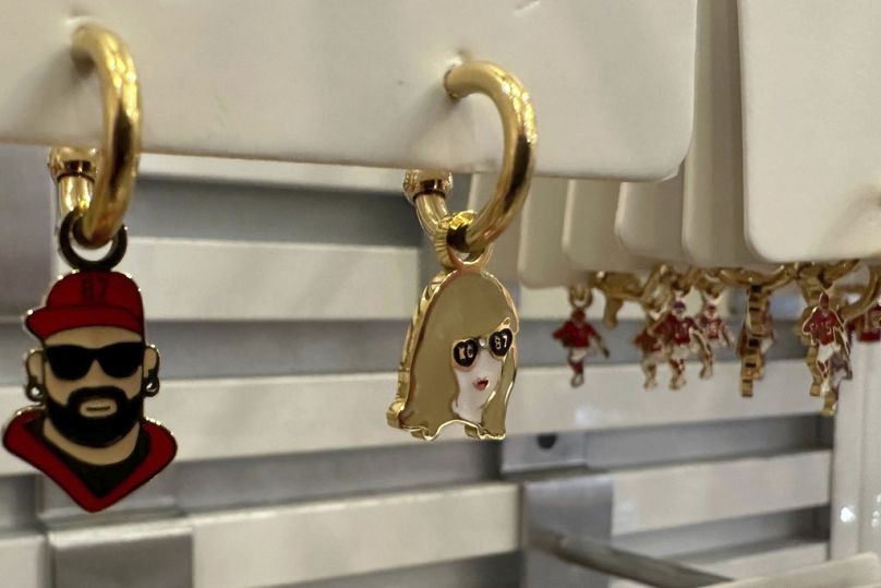 Fans are cashing in on Super Bowl's 'golden couple' with countless pieces of merch - including these 'Travis and Taylor' earrings