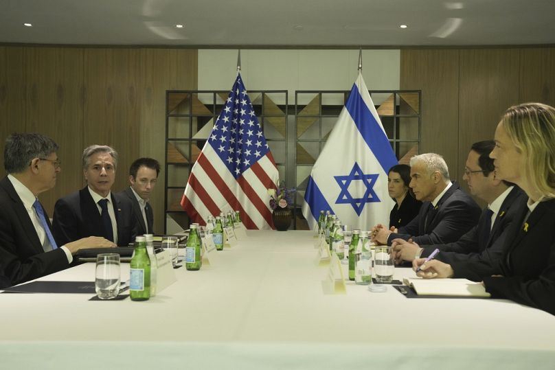 U.S. Secretary of State Antony Blinken, second left, meets with Israeli opposition leader Yair Lapid, third from right, in Tel Aviv, Israel, Thursday, Feb. 8, 2024.