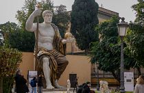 Visitors admire a massive, 13-meter (yard) replica of the statue Roman Emperor Constantine commissioned for himself after 312 AD