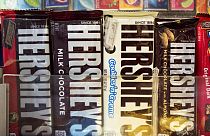 In this Friday, Oct. 7, 2016, photo, Hershey's chocolate bars are displayed on a newsstand, in New York.