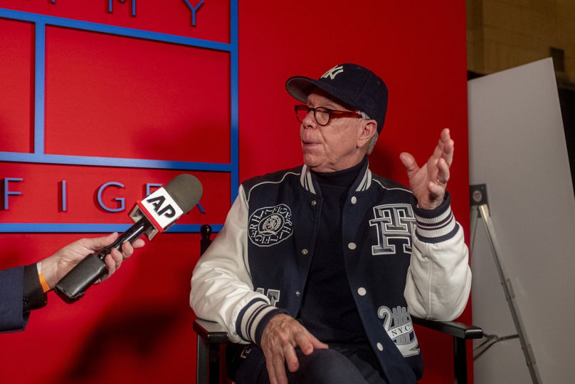 Designer Tommy Hilfiger is interviewed by Associated Press reporter John Carucci before Hilfiger's Fashion Week runway show Friday, Feb. 9, 2024, in New York.
