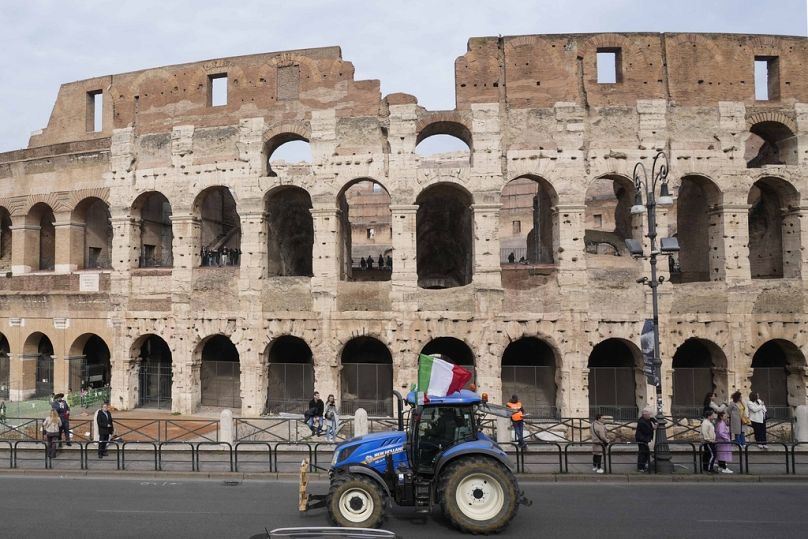 A farmer tractor runs in front of the Rome's Colosseum to protest government and EU agriculture policies, February 2024