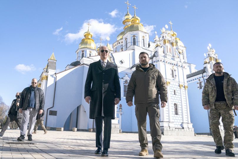 FILE – U.S. President Joe Biden walks with Ukrainian President Volodymyr Zelenskyy in Kyiv, Ukraine, Monday, Feb. 20, 2023.
