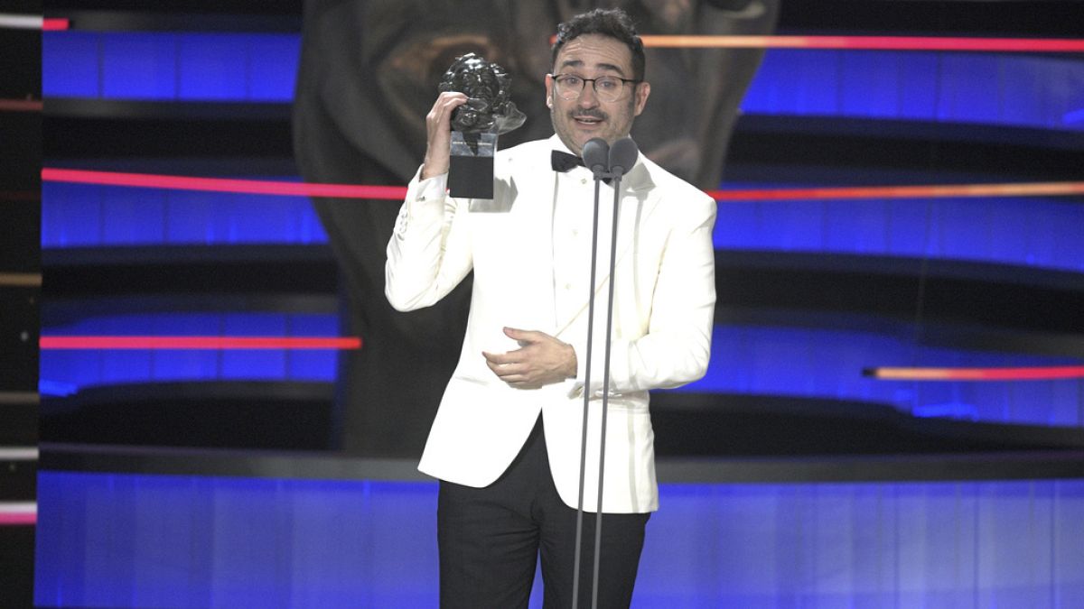 Filmmaker Juan Antonio Bayona holds the Goya for "Best Original Score" on behalf of Michael Giacchino for his work on "The Snow Society," on 10 Feb. 2024.