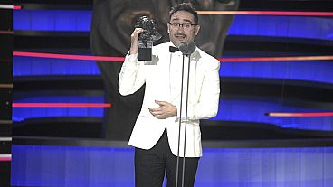 Filmmaker Juan Antonio Bayona holds the Goya for "Best Original Score" on behalf of Michael Giacchino for his work on "The Snow Society," on 10 Feb. 2024.