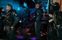 Police officers run a checkpoint set up in a nightclub zone of San Jose, Costa Rica, Saturday, Aug. 18, 2023. 