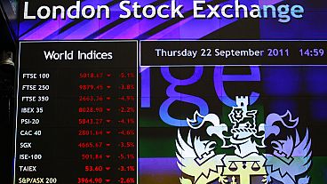 A screen displays market information inside the London Stock Exchange in the City of London, Thursday, Sept. 22, 2011. 