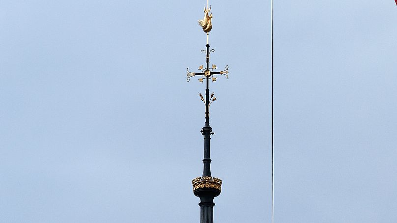 Scaffolding is being removed around the spire of Notre Dame de Paris cathedral, showing the rooster and the cross, Monday, Feb. 12, 2024 in Paris.