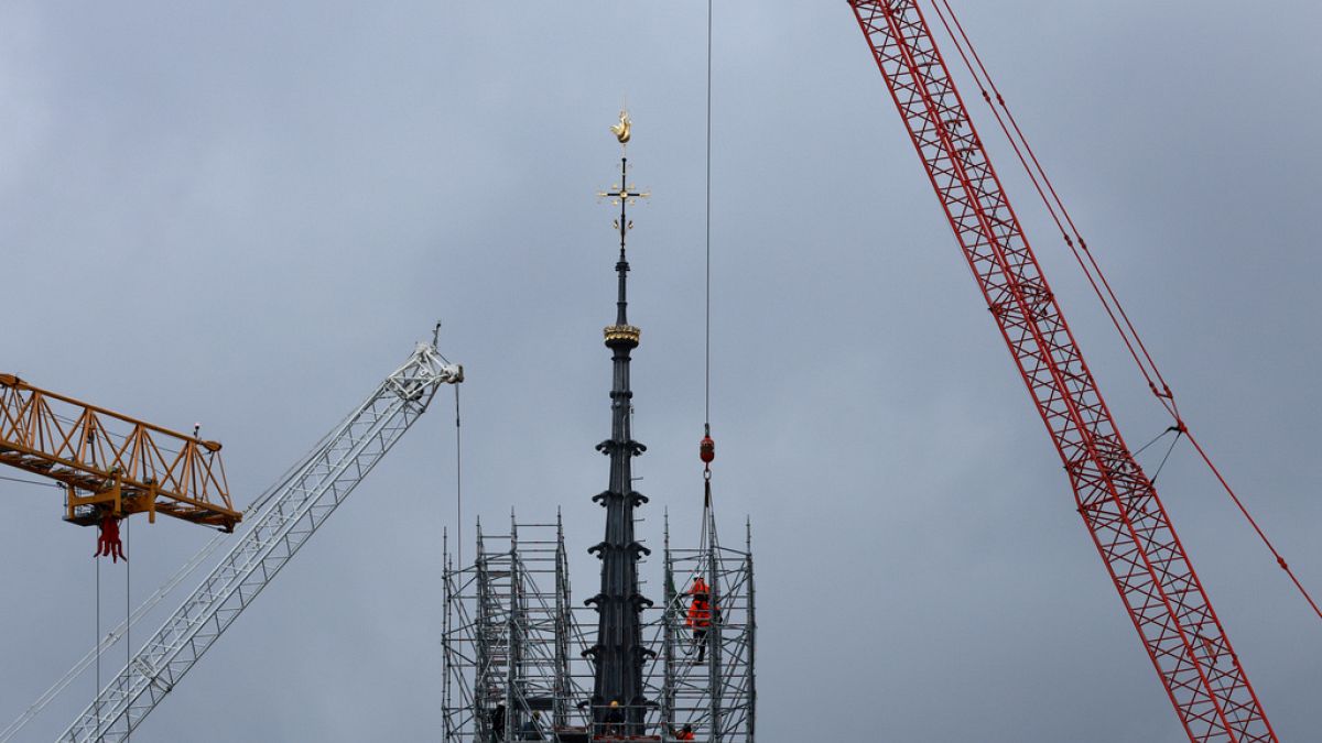 Notre Dame reveals new spire and golden rooster as scaffolding removed thumbnail