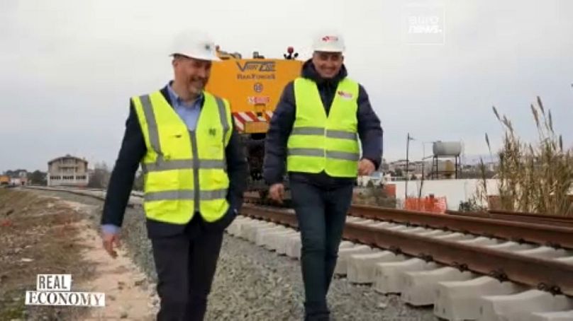 Euronews Reporter Paul Hackett and Bashkim Kasoruhu, the head of Albanian Railways, Project Implementation Unit.