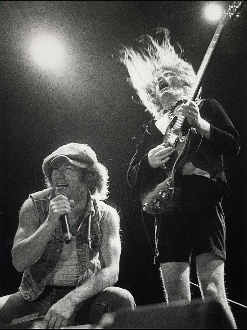AC/DC vocalist Brian Johnson and lead guitarist Angus Young perform at Southern Star Amphitheater in Houston, Oct. 12, 1985
