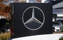 The company logo adorns a sign outside a Mercedes Benz dealership Monday, Oct. 17, 2022, in Loveland, Colo. (AP Photo/David Zalubowski)