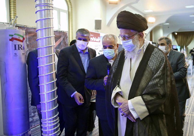 Supreme Leader Ayatollah Ali Khamenei, right, visits an exhibition of the country's nuclear achievements, at his office compound in Tehran, Iran, Sunday, June 11, 2023.