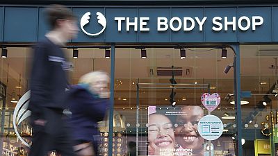 People walk past a Body Shop store in Canterbury, England, Tuesday, Feb. 13, 2024.