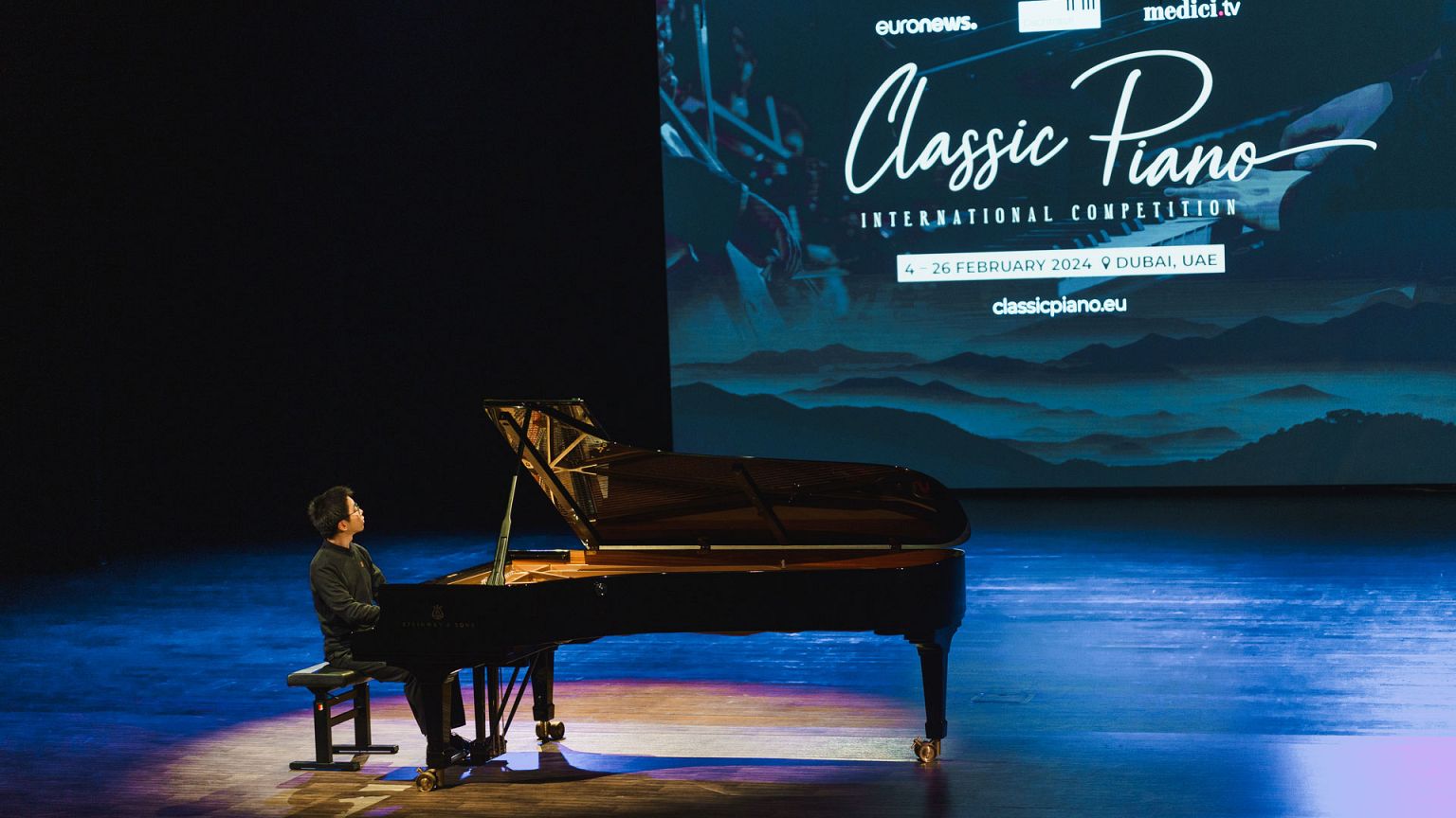 A musician plays the piano.