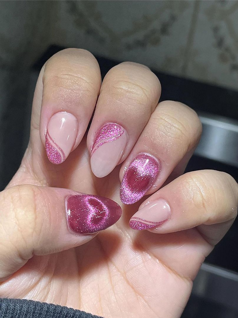 This photo shows an example of magnetic heart nails, a popular trend on TikTok.