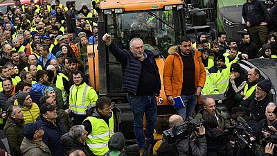 Farmers with their tractors attend a protest in Pamplona, northern Spain, Friday, Feb. 9, 2024. For fourth non stop days, farmers in Spain have staged tractor protests across 
