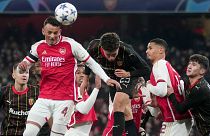 Arsenal's Ben White, front left, heads the ball during the Champions League Group B soccer match between Arsenal and Lens, at Emirates stadium, in London, 29 November 2023.